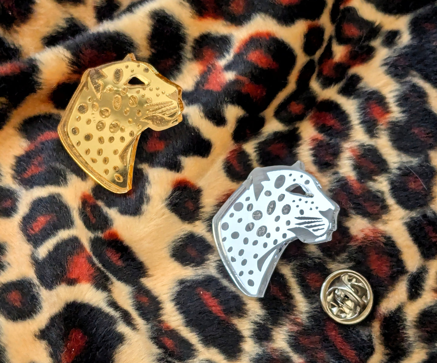 Handmade laser Leopard Heads in Silver or Gold Mirrored Acrylic with intricate leopard spot detailing.