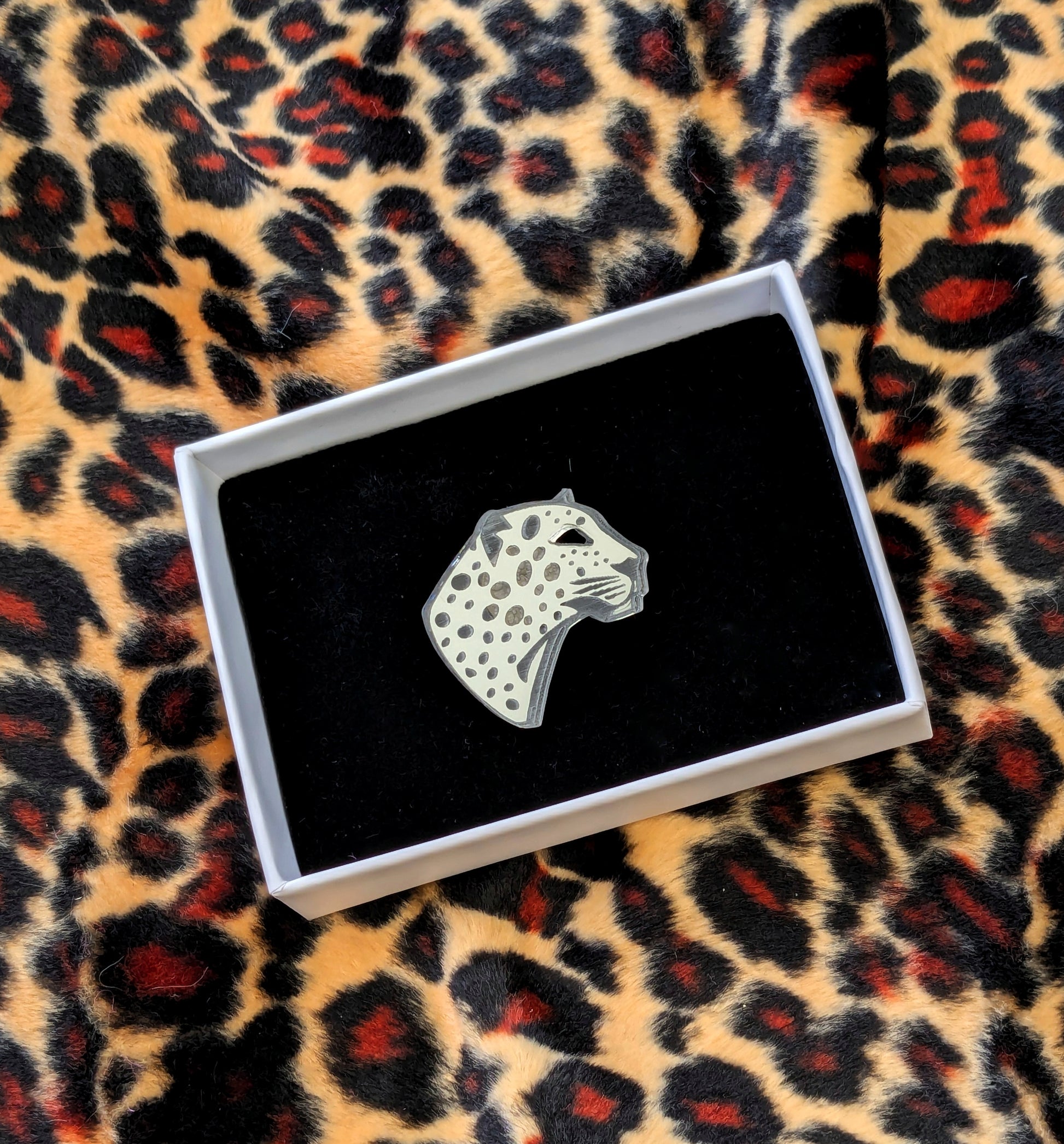 Handmade laser Leopard Heads in Silver Mirrored Acrylic with intricate leopard spot detailing.