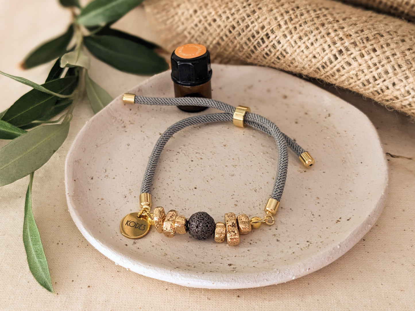 Resilience – Light Grey Aromatherapy Essential Oil Diffuser Bracelet with Lava Bead and Gold Hematite Stones