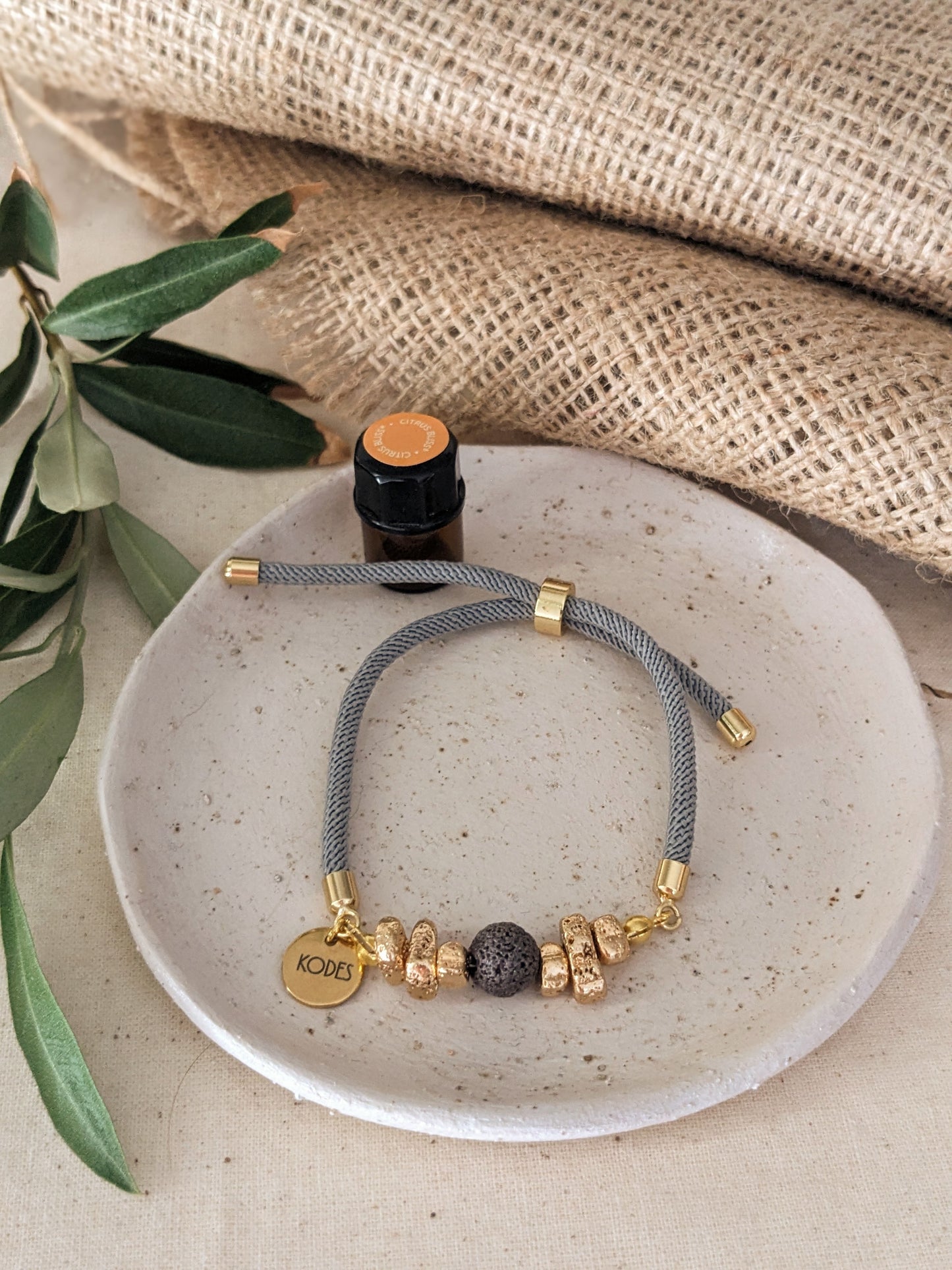 Resilience – Light Grey Aromatherapy Essential Oil Diffuser Bracelet with Lava Bead and Gold Hematite Stones