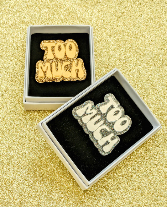 Acrylic 'Too Much' Brooches in silver and gold