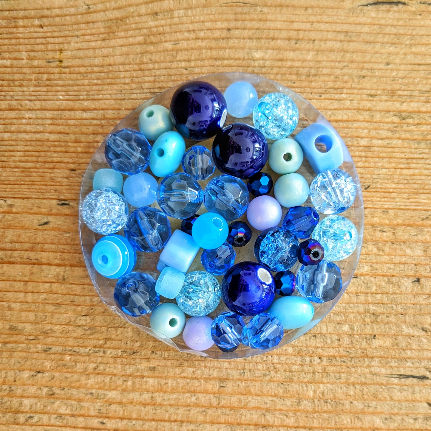 Variety of  glass and acrylic beads in blues